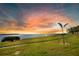 Lush green grounds with a view of the ocean, palm trees and manicured lawns at sunset at 6158 Palma Del Mar S Blvd # 604, St Petersburg, FL 33715