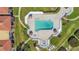 Aerial view of pool area with lounge chairs, spa, and well-manicured landscaping at 6158 Palma Del Mar S Blvd # 604, St Petersburg, FL 33715