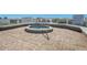 Outdoor spa featuring brick flooring, white fencing and a handrail for easy access at 6158 Palma Del Mar S Blvd # 604, St Petersburg, FL 33715