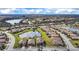 Expansive aerial view showcases a well-planned community with lakes and lush landscaping at 6914 Quiet Creek Dr, Bradenton, FL 34212