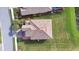 Aerial view of a home with a terracotta tile roof and well-manicured landscaping at 6914 Quiet Creek Dr, Bradenton, FL 34212
