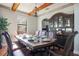 Elegant dining room featuring a large table set for a meal and a decorative china cabinet at 6914 Quiet Creek Dr, Bradenton, FL 34212