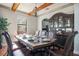Elegant dining room with wood floors, decorative chandelier and a hutch for storage at 6914 Quiet Creek Dr, Bradenton, FL 34212