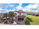 Beautiful two-story home with a tile roof, paved driveway, and well-manicured landscaping at 6914 Quiet Creek Dr, Bradenton, FL 34212