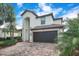 Beautiful two-story home with a tile roof, paved driveway, and well-maintained landscaping at 6914 Quiet Creek Dr, Bradenton, FL 34212