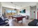 Spacious game room features a pool table, tile flooring, and ample natural light at 6914 Quiet Creek Dr, Bradenton, FL 34212