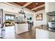 Contemporary kitchen features an island, stainless steel appliances, granite countertops and tile floors at 6914 Quiet Creek Dr, Bradenton, FL 34212