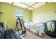 Bright home office with a comfortable sofa, a desk, and a large window at 6914 Quiet Creek Dr, Bradenton, FL 34212