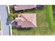 Aerial view of a home's tile roof with clean lines and surrounding green landscape at 6914 Quiet Creek Dr, Bradenton, FL 34212