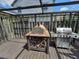 This rustic back deck includes an outdoor pizza oven and stainless steel grill for easy entertaining at 8922 Pritcher Rd, Lithia, FL 33547