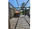 This rustic back deck includes an outdoor pizza oven perfect for entertaining friends and Gathering at 8922 Pritcher Rd, Lithia, FL 33547