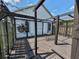 The back deck has a decorative trellis and cozy seating area at 8922 Pritcher Rd, Lithia, FL 33547