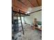 Inside view of a barn featuring a straw ceiling and ladder leading to a sleeping loft at 8922 Pritcher Rd, Lithia, FL 33547