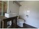 Modern bathroom with square vessel sink, and custom wooden vanity at 8922 Pritcher Rd, Lithia, FL 33547