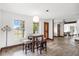 Cozy dining area with large windows, lots of natural light, and unique wood-trimmed openings at 8922 Pritcher Rd, Lithia, FL 33547