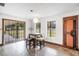 Bright dining area with a modern light fixture and view of the outdoors at 8922 Pritcher Rd, Lithia, FL 33547