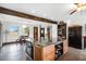 Spacious kitchen featuring a granite island, dark wood cabinets, stainless appliances, and plenty of storage at 8922 Pritcher Rd, Lithia, FL 33547