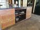 Kitchen island with built-in storage and a dark countertop providing ample space for food preparation at 8922 Pritcher Rd, Lithia, FL 33547