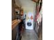 This well-lit laundry room offers plenty of storage and organization potential at 8922 Pritcher Rd, Lithia, FL 33547