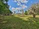 Expansive lot with beautiful two story home, large grassy area, and mature trees at 8922 Pritcher Rd, Lithia, FL 33547