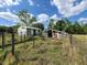 Shed and other outbuildings in fenced grassy area at 8922 Pritcher Rd, Lithia, FL 33547