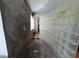 Stylish shower with unique pebble flooring, yin yang design wall, and glass block partition at 8922 Pritcher Rd, Lithia, FL 33547
