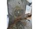 Custom shower showcasing pebble flooring, stone art feature, and a modern showerhead at 8922 Pritcher Rd, Lithia, FL 33547
