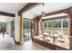 Inviting Zen Room featuring wood beam details, floor seating, and outdoor views at 8922 Pritcher Rd, Lithia, FL 33547
