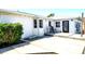 A simple backyard setup with a concrete patio and black chair at 1046 Lee St, Englewood, FL 34224