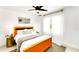 Inviting bedroom with a vibrant bedframe, tiled floors, and ample natural light at 1046 Lee St, Englewood, FL 34224