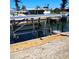 Image of a boat dock featuring a boat lift and waterfront access in a serene neighborhood at 1046 Lee St, Englewood, FL 34224
