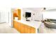 Bright kitchen with a large center island, plenty of storage, and open layout to the living area at 1046 Lee St, Englewood, FL 34224