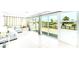 Sunroom with tile flooring and sliding glass doors opening to a waterfront view at 1046 Lee St, Englewood, FL 34224