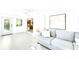 Inviting living room with modern tile floors, clean lines, and neutral colors create a relaxing space at 1046 Lee St, Englewood, FL 34224