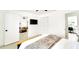 Main bedroom featuring closet, TV, and ensuite bathroom at 1046 Lee St, Englewood, FL 34224
