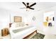 Bright, modern main bedroom suite with light walls, wood accents, and tiled floor at 1046 Lee St, Englewood, FL 34224