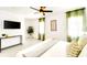 Spacious main bedroom featuring tile floor, neutral tones, and light-filled windows with sheer curtains at 1046 Lee St, Englewood, FL 34224
