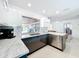 Modern kitchen featuring gray cabinetry, stainless steel appliances and marble counter tops at 1901 Upper Cove Ter, Sarasota, FL 34231