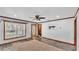 Living room showcasing front window views and a plank wall with mounted television at 3517 Ralston Rd, Plant City, FL 33566