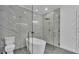 Elegant bathroom featuring a freestanding tub and glass-enclosed shower with stylish gray tile at 12484 Green Oak Ln, Dade City, FL 33525