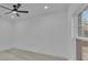 Comfortable bedroom with wood flooring, neutral walls, ceiling fan and good natural light at 12484 Green Oak Ln, Dade City, FL 33525