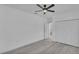 Spacious bedroom with ample closet space, featuring neutral walls and light wood floors at 12484 Green Oak Ln, Dade City, FL 33525