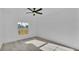 Bright bedroom with large window and hardwood floors, offers comfort and natural light at 12484 Green Oak Ln, Dade City, FL 33525