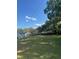 Backyard with a mix of open space and mature trees at 37906 Tucker Rd, Zephyrhills, FL 33542