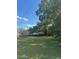 Backyard featuring a large tree providing ample shade at 37906 Tucker Rd, Zephyrhills, FL 33542