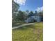 Charming exterior of house surrounded by lush green lawn at 37906 Tucker Rd, Zephyrhills, FL 33542