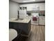 Well-lit kitchen area with center island, appliances, and ample counter space at 37906 Tucker Rd, Zephyrhills, FL 33542