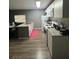 Kitchen featuring modern appliances, a center island, and granite countertops at 37906 Tucker Rd, Zephyrhills, FL 33542