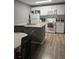 Kitchen area with center island, white appliances, and modern, neutral decor at 37906 Tucker Rd, Zephyrhills, FL 33542
