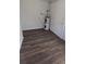 Unfinished room showcases attractive laminate flooring and a newer water heater at 37906 Tucker Rd, Zephyrhills, FL 33542